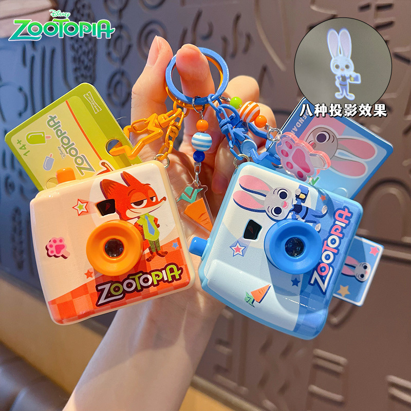 Kids Party Games - オリジナルズートピアポラロイドカメラキーホルダークリエイティブ子供のおもちゃバックパックキーホルダーペンダントギフト子供の誕生日パーティーのお土産
